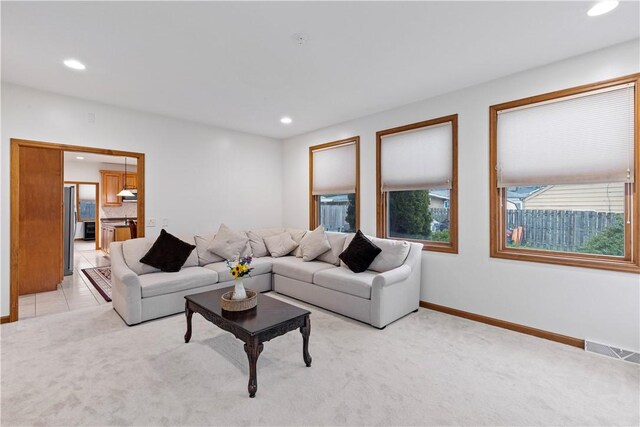 704 Park Ave, Rostraver, PA 15012 - living room featuring light carpet, recessed lighting, and baseboards