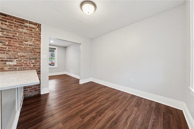 1110 Illinois Ave, Dormont, PA 15216 - unfurnished living room with dark wood finished floors and baseboards