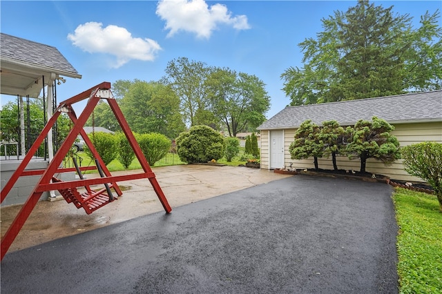 2735 20th Street Ext, Patterson Twp, PA 15010 - view of patio / terrace featuring a playground and asphalt driveway