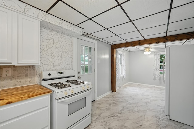 2735 20th Street Ext, Patterson Twp, PA 15010 - kitchen featuring white appliances, wooden counters, decorative backsplash, white cabinets, and a ceiling fan