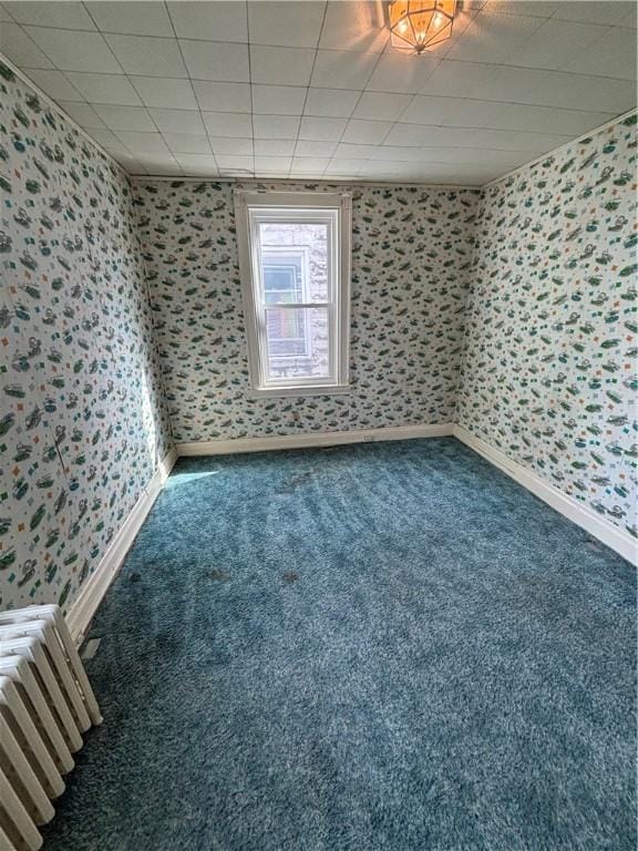 7027 Blackhawk St, Swissvale, PA 15218 - spare room featuring wallpapered walls, carpet floors, and baseboards