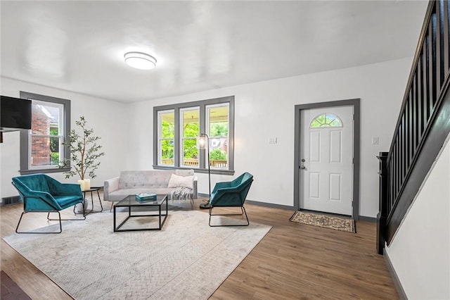 1815 Ohio Ave, White Oak, PA 15131 - living area featuring stairs, wood finished floors, and baseboards