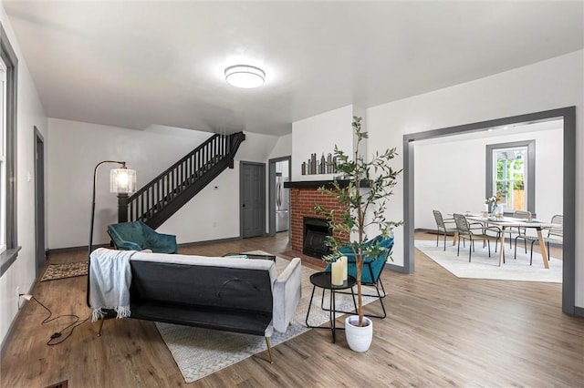 1815 Ohio Ave, White Oak, PA 15131 - living area with stairway, wood finished floors, a fireplace, and baseboards