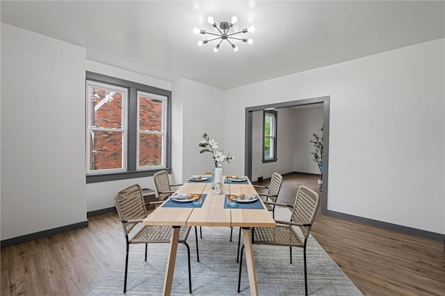 1815 Ohio Ave, White Oak, PA 15131 - dining area featuring wood finished floors, a chandelier, and baseboards
