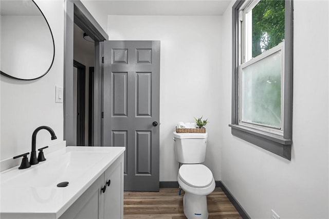 1815 Ohio Ave, White Oak, PA 15131 - bathroom featuring wood finished floors, toilet, vanity, and baseboards