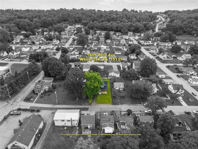 1815 Ohio Ave, White Oak, PA 15131 - aerial perspective of suburban area with property parcel outlined and a heavily wooded area