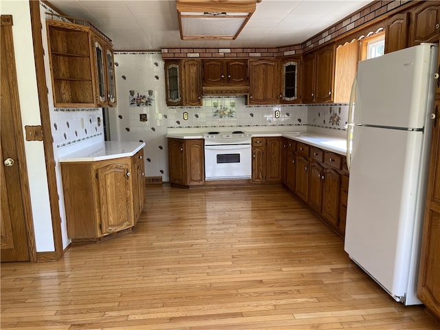 100 Rohaley Ln, Menallen Twp, PA 15480 - kitchen featuring white appliances, custom exhaust hood, light wood-style flooring, and glass insert cabinets