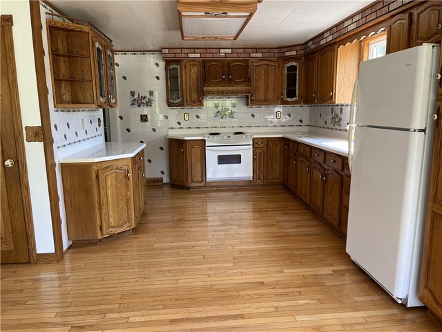 100 Rohaley Ln, Menallen Twp, PA 15480 - kitchen featuring white appliances, custom exhaust hood, light wood-style flooring, and glass insert cabinets