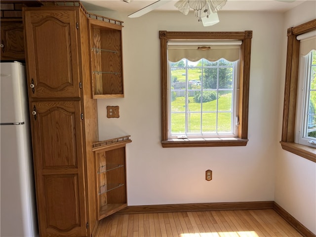 100 Rohaley Ln, Menallen Twp, PA 15480 - unfurnished dining area featuring healthy amount of natural light, light wood-type flooring, and baseboards