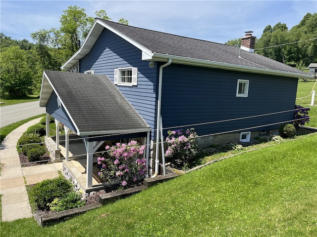 100 Rohaley Ln, Menallen Twp, PA 15480 - view of side of property featuring a chimney, a lawn, and a shingled roof