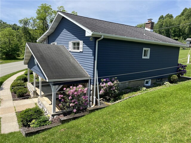 100 Rohaley Ln, Menallen Twp, PA 15480 - view of side of property featuring a chimney, a lawn, and a shingled roof