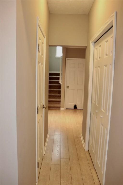 127 Benton, Canonsburg, PA 15317 - hallway with light wood-type flooring, stairway, and baseboards