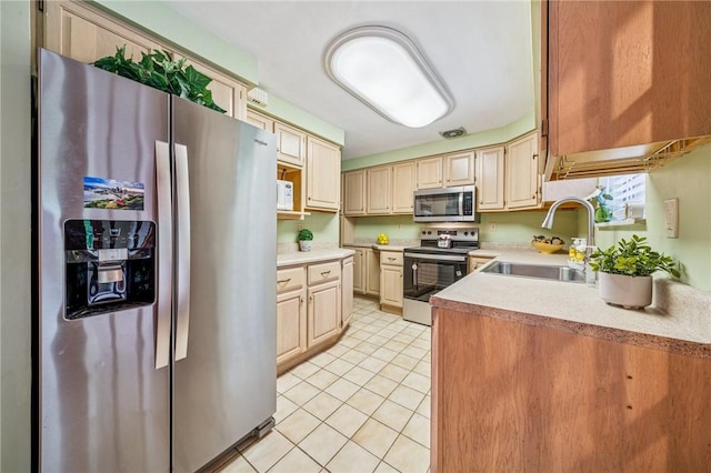 1371 Blue Jay Dr, Scott Twp Sal, PA 15243 - kitchen featuring appliances with stainless steel finishes, a sink, light countertops, and light tile patterned flooring