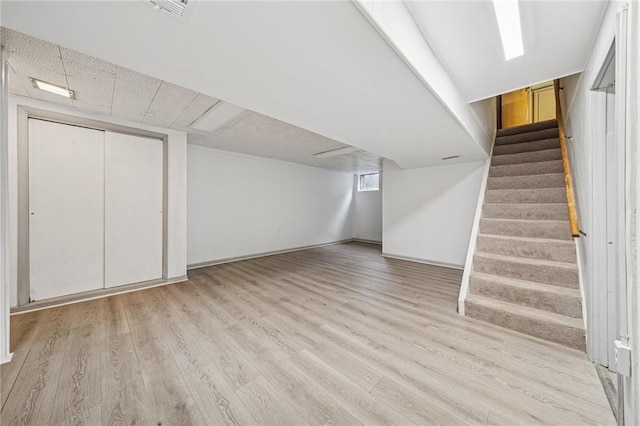 1371 Blue Jay Dr, Scott Twp Sal, PA 15243 - below grade area featuring stairs, wood finished floors, and baseboards