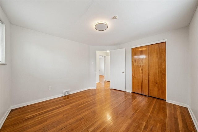 1371 Blue Jay Dr, Scott Twp Sal, PA 15243 - unfurnished bedroom featuring wood finished floors, baseboards, and a closet