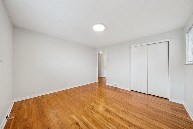 1371 Blue Jay Dr, Scott Twp Sal, PA 15243 - unfurnished bedroom featuring light wood finished floors, a closet, and baseboards