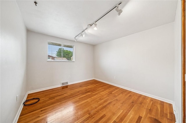 1371 Blue Jay Dr, Scott Twp Sal, PA 15243 - spare room featuring track lighting, light wood finished floors, baseboards, and a pendent fire sprinkler