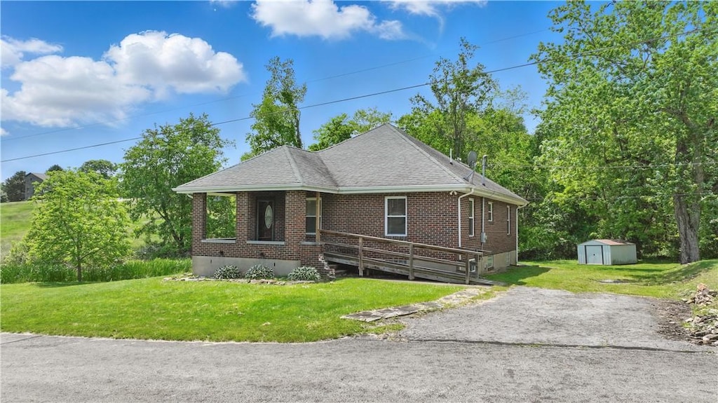 1771 Independence St, Menallen Twp, PA 15401 - bungalow with brick siding, a shingled roof, and a front yard
