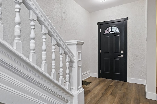 134 Poplargrove St, Carrick, PA 15210 - entrance foyer with a textured wall, wood finished floors, and baseboards