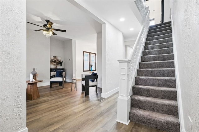 134 Poplargrove St, Carrick, PA 15210 - staircase featuring wood finished floors, a ceiling fan, baseboards, a textured wall, and recessed lighting