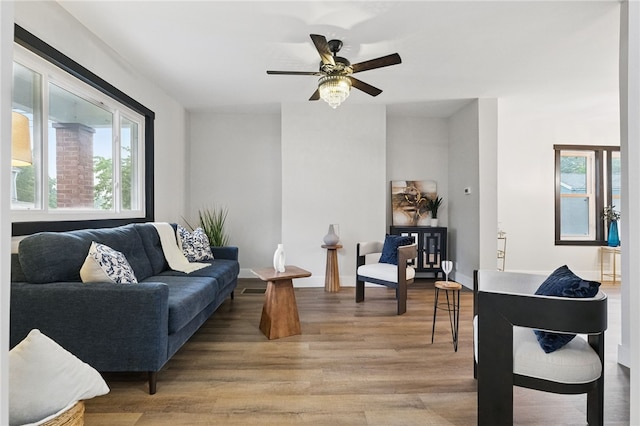 134 Poplargrove St, Carrick, PA 15210 - living room with healthy amount of natural light, light wood-style flooring, a ceiling fan, and baseboards