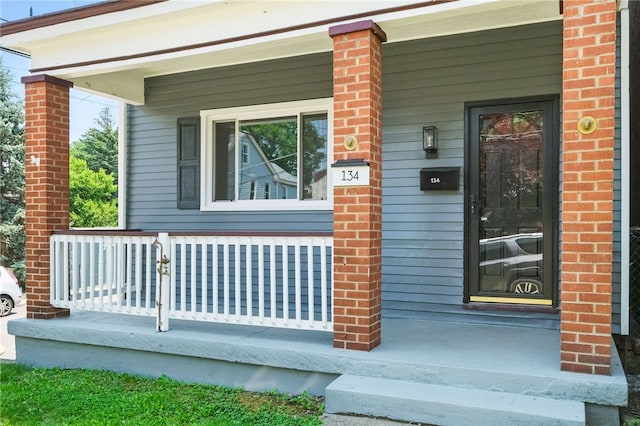 134 Poplargrove St, Carrick, PA 15210 - property entrance featuring covered porch and brick siding