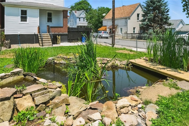 134 Poplargrove St, Carrick, PA 15210 - view of yard with a garden pond and a dock