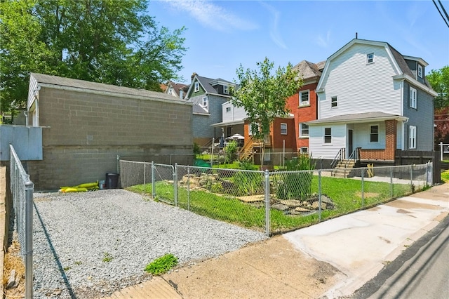 134 Poplargrove St, Carrick, PA 15210 - rear view of house with a fenced front yard, a gate, a gambrel roof, and a residential view