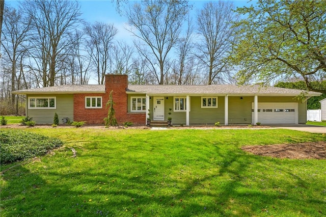 385 Vogan Dr, Mercer Boro Mer, PA 16137 - single story home with an attached garage, a chimney, driveway, a front yard, and brick siding