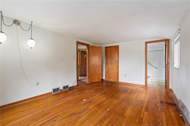 173 Mcintyre Rd, Ross Twp, PA 15237 - empty room with wood-type flooring, vaulted ceiling, and baseboards
