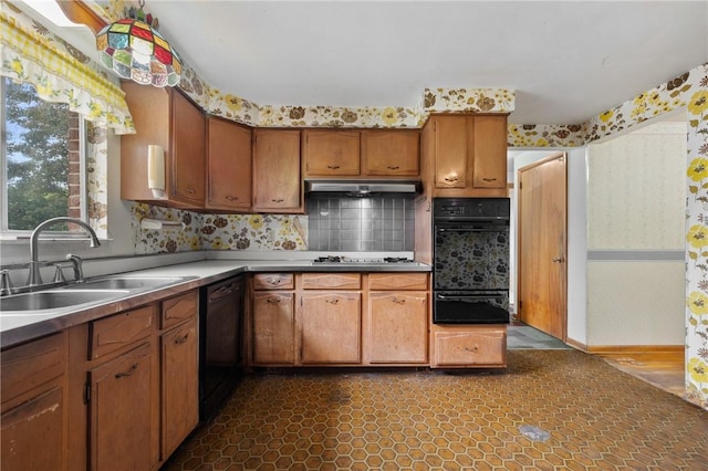 173 Mcintyre Rd, Ross Twp, PA 15237 - kitchen featuring a sink, a warming drawer, wallpapered walls, under cabinet range hood, and brown cabinets