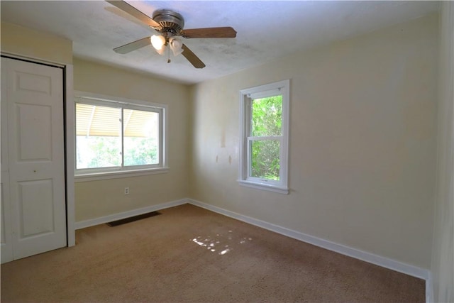 1818 Bluff St, West Mifflin, PA 15122 - carpeted empty room with healthy amount of natural light, baseboards, and a ceiling fan