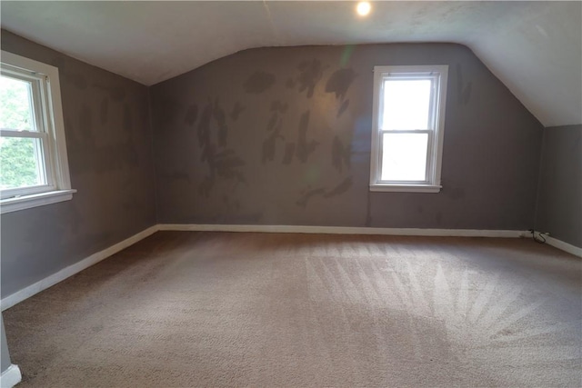1818 Bluff St, West Mifflin, PA 15122 - additional living space featuring vaulted ceiling, healthy amount of natural light, baseboards, and carpet