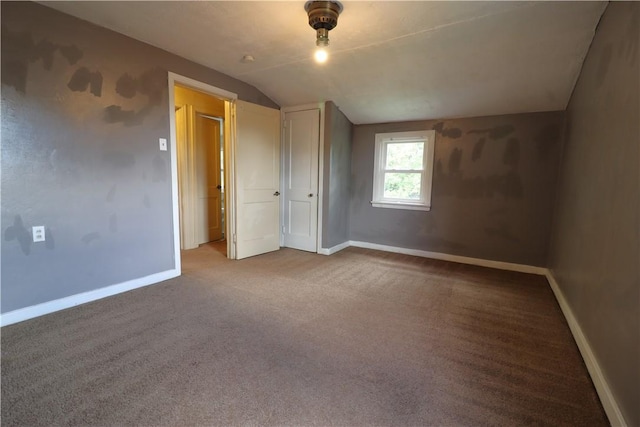 1818 Bluff St, West Mifflin, PA 15122 - unfurnished bedroom with vaulted ceiling, baseboards, and carpet