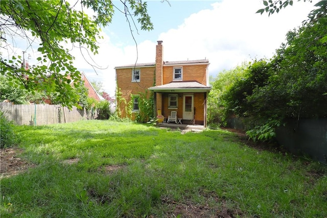 1818 Bluff St, West Mifflin, PA 15122 - rear view of property with a chimney and brick siding