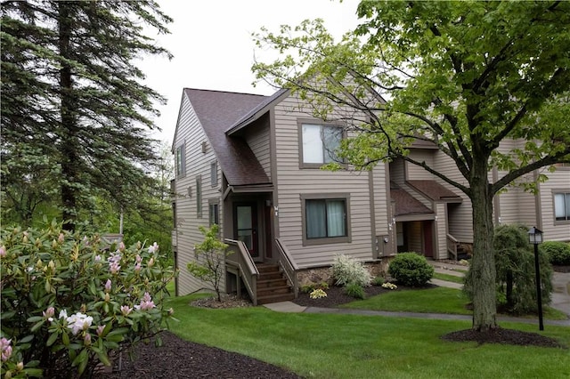 W1 Sunridge Dr, Seven Springs Resort, PA 15622 - view of front of house with a front yard and a shingled roof
