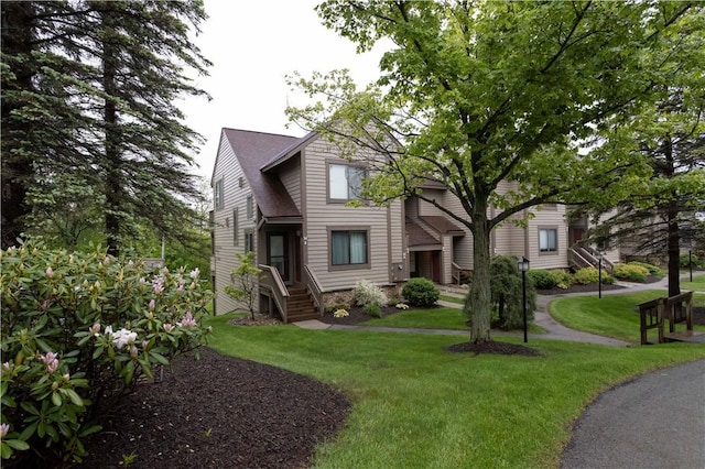 W1 Sunridge Dr, Seven Springs Resort, PA 15622 - view of front facade with a front lawn and roof with shingles