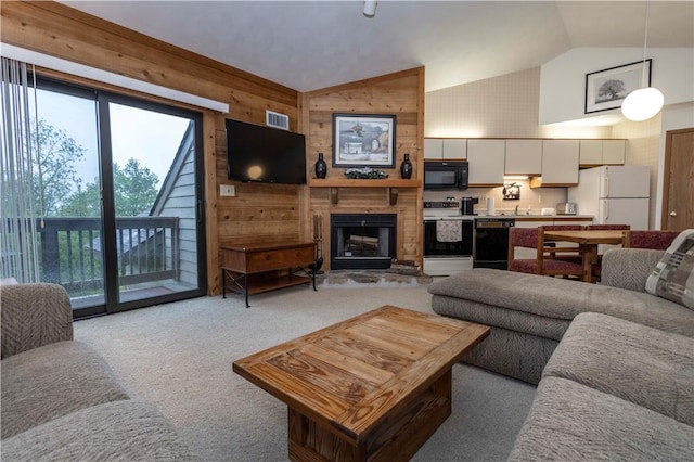 W1 Sunridge Dr, Seven Springs Resort, PA 15622 - living area with wood walls, healthy amount of natural light, light colored carpet, high vaulted ceiling, and a large fireplace