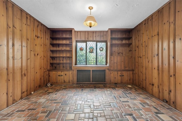1 Robin Rd, Squirrel Hill, PA 15217 - unfurnished room with wooden walls and brick flooring