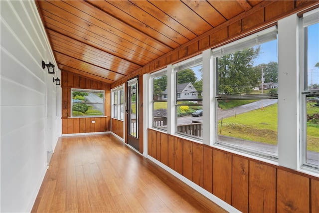 1231 19th Ave, Patterson Twp, PA 15010 - unfurnished sunroom featuring hardwood / wood-style floors, vaulted ceiling, wooden walls, wood ceiling, and baseboards