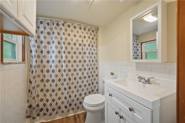 1231 19th Ave, Patterson Twp, PA 15010 - full bathroom featuring tile walls, vanity, toilet, and curtained shower