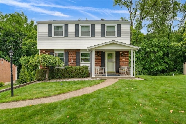 534 Dendron Dr, Robinson Twp Nwa, PA 15108 - view of front of house featuring brick siding, covered porch, and a front lawn