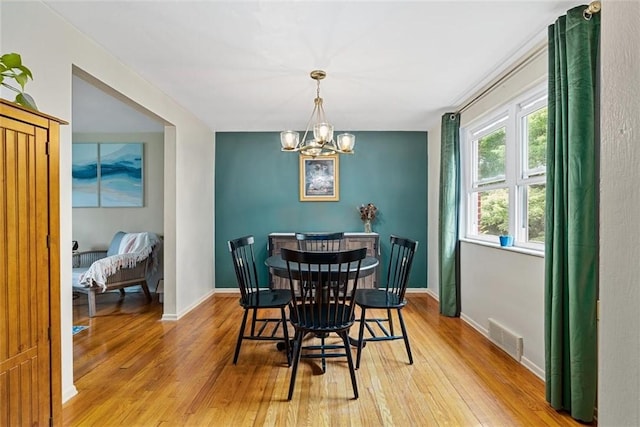 534 Dendron Dr, Robinson Twp Nwa, PA 15108 - dining area featuring light wood finished floors, a chandelier, and baseboards