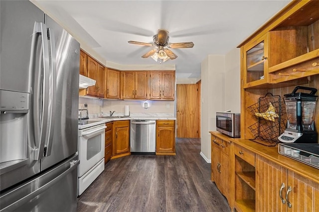 534 Dendron Dr, Robinson Twp Nwa, PA 15108 - kitchen with stainless steel appliances, under cabinet range hood, brown cabinets, dark wood-style flooring, and a sink