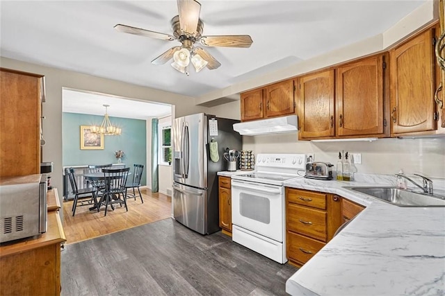 534 Dendron Dr, Robinson Twp Nwa, PA 15108 - kitchen with stainless steel appliances, a sink, under cabinet range hood, and brown cabinets