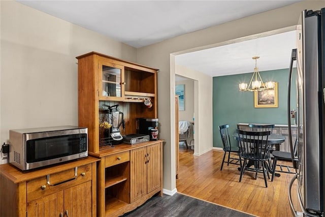 534 Dendron Dr, Robinson Twp Nwa, PA 15108 - kitchen with stainless steel appliances, dark wood-type flooring, a chandelier, and open shelves