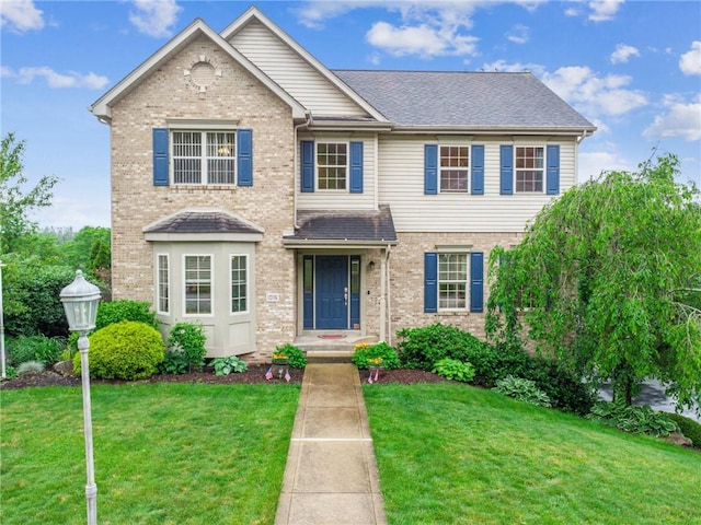 1016 Noble Pine Ct, Trafford, PA 15085 - view of front facade with brick siding and a front lawn