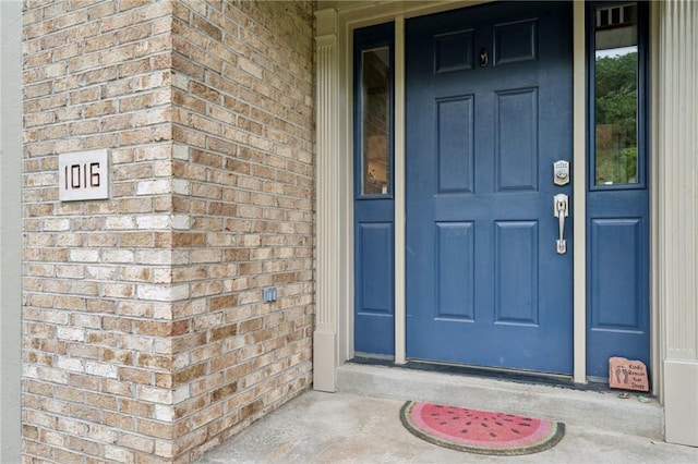 1016 Noble Pine Ct, Trafford, PA 15085 - doorway to property featuring brick siding and covered porch