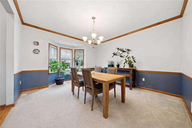 1016 Noble Pine Ct, Trafford, PA 15085 - dining space with crown molding, a chandelier, baseboards, and light colored carpet