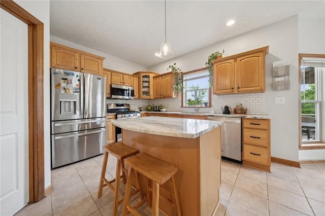 1016 Noble Pine Ct, Trafford, PA 15085 - kitchen with stainless steel appliances, light tile patterned floors, decorative backsplash, glass insert cabinets, and recessed lighting